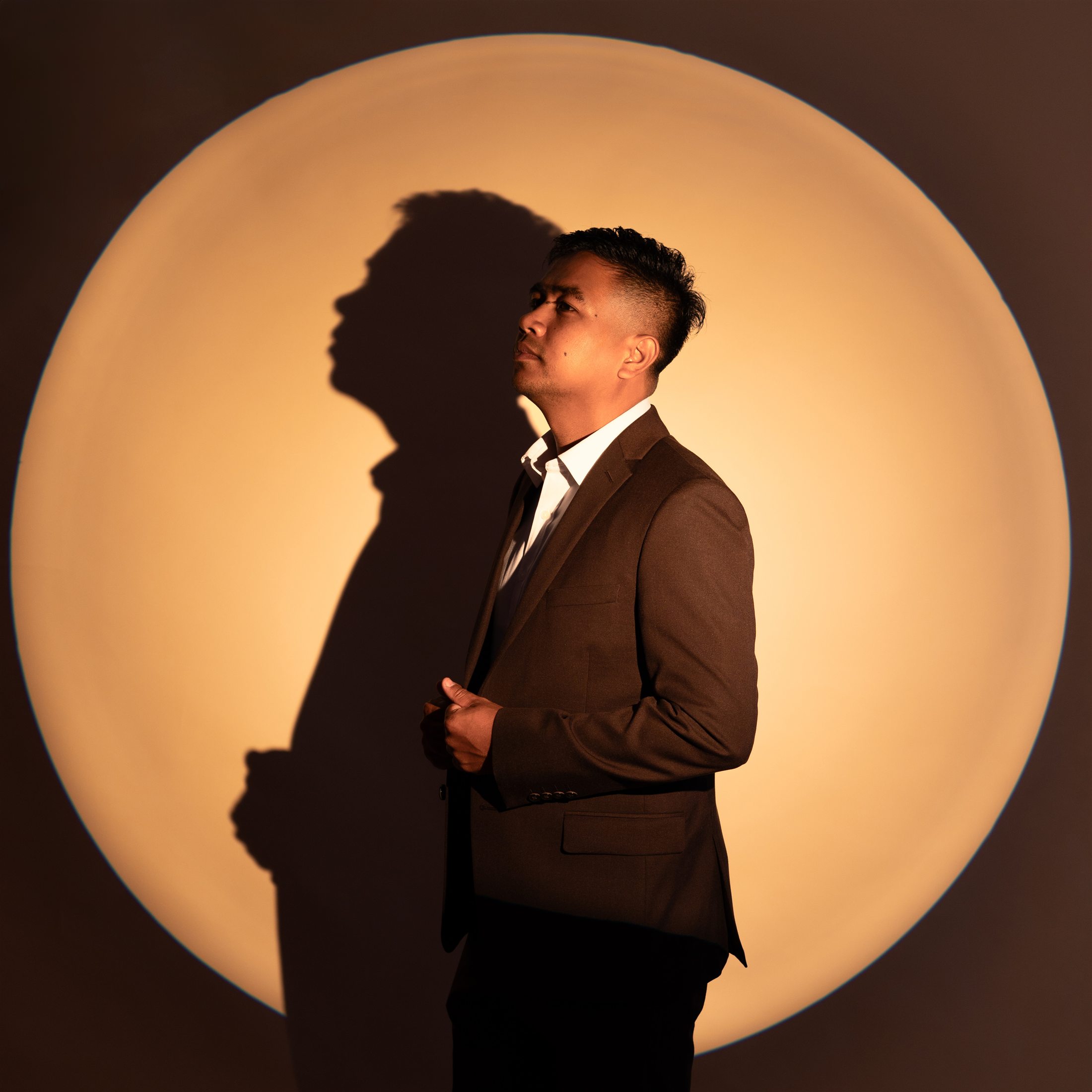 Studio portrait shaped with a circular amber light